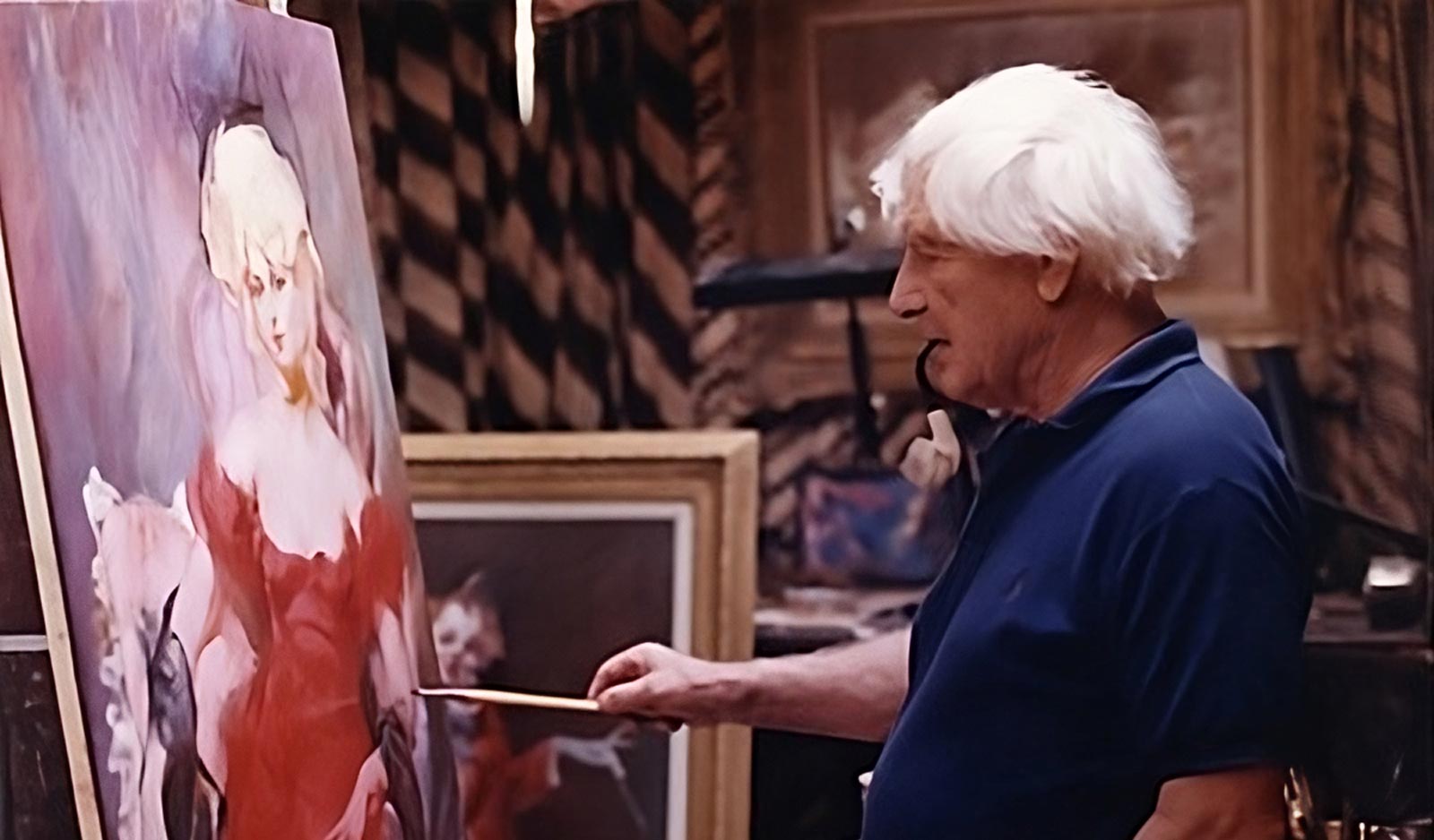 Julian Ritter painting a model in a red dress